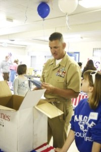 Ray Griffith unwarps the final care package given to him by his Langley pen pals.