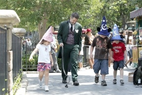 Gordon Free takes ghost dog Fifi out for a walk at Disneyland. Walking the dogs was just one of his jobs during his Disney Dream Jobs stay in California.