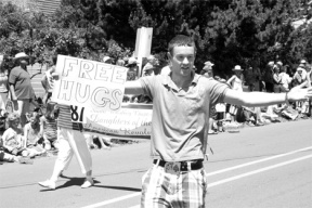 Zach Broyles offers hugs at the Maxwelton Parade. If you want more