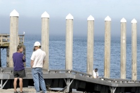 Bush Point on-site manager Mike McCarthy and Port of South Whidbey port manager Ed Field check out the boat launch ramp after a Department of Fish and Wildlife construction crew finished getting the floats in the water on Thursday.