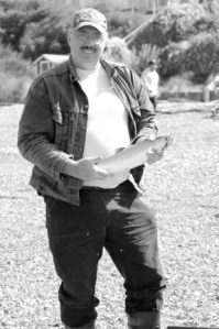 Freeland's Carl Knutsen poses with his freshly-caught "almost 4-pound" salmon at Bush Point on Thursday. Knutsen and friend Roni MacGrigor come out about every other day when the fish are biting. "We love to fish