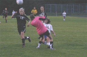 Forward Grace Itaya mixes it up with the Red Wolf goalie Tuesday — her attempted goal missed the net by inches. The Lady Falcons lost 5-1