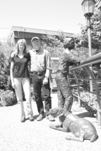 Georgia Gerber and Pete Jordan stand beside Gerber’s Boy and Dog sculpture