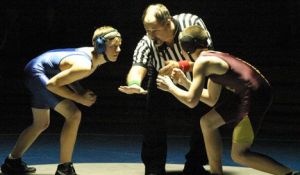 Aaron Mannie (right) warily approaches his match with Wildcat opponent Daryn Glenn Dec. 5 - 30 seconds later