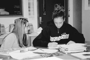 Sophomore Ale Cordero and senior Carissa Moore collaborate on a graphic design assignment in their first-period graphic design class.