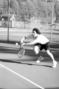 Brendan Toyama returns a serve from Squalicum's Spencer McCain on Wednesday.