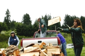 Volunteers that Hearts and Hammers president Randy Hudson calls “woodchucks” delivered firewood to various homes during the Hearts and Hammers workday on Saturday. Home-repair volunteers helped unload wood at Home #25 near Triangle Road in Langley.