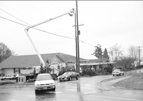 A construction crew installs the antenna assembly Tuesday for a Sprint PCS cellular phone facility at the corner of Sixth Street and Cascade Avenue in Langley.