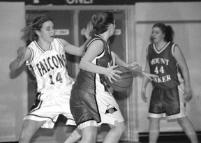 Karen Schwager puts up airtight defense in the first half of the Falcons' game Friday against Mount Baker. South Whidbey held the Mountaineers to 15 points in the first half.