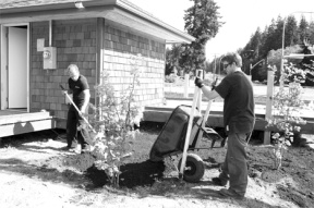 Work crews are landscaping the Rotary Park at the new visitor center in time for opening day May 18.