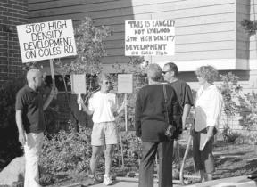 Picketers against possible annexation of a portion of Coles Road stood outside of City Hall in Langley Wednesday before a Langley City Council meeting. Over 60 people were in attendance at the informational meeting to show their disapproval for the potential project.