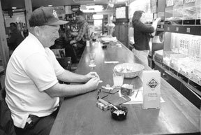 Mike Gibbons plays pull tabs at the Cozy Roadhouse in Clinton. This legal form of gambling is coming to Langley’s China City sometime during the next two weeks.