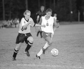 Junior defender Lena Ishii moves the ball around Granite Falls' zone in the Falcons' 6-1 Thursday night win over the Tigers. Earlier in the week