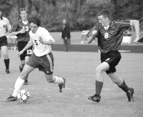 Senior Kelly Foote keeps the ball from a Lakewood Cougar Monday. The Falcons won the home game 4-2