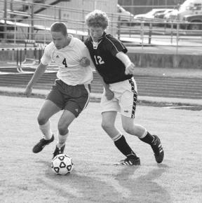Senior Falcon Abe Smith-Groening keeps a Borderite striker from gaining possession of the ball Friday. After winning 5-0 against Blaine