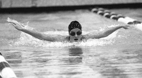 South Whidbey senior Sarah Bartlett pushes herself to her best race of the year in the 100-yard butterfly at the Northwest District.