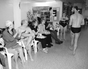 Clapping congratulations for Kurt Johnson after his 200-yard freestyle swim