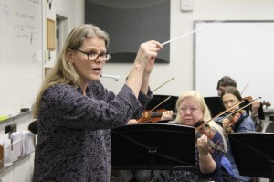 Kyle Jensen / The Record                                Conductor and musical director Anna Edwards leads the orchestra during a rehearsal.