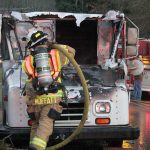 Kyle Jensen / The Record                                South Whidbey Fire/EMS Deputy Chief Wendy Moffatt douses the flames.