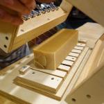 Contributed photo                                Hall cuts through a brick of soap with his hand made soap cutter.