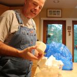 Kyle Jensen / The Record                                Hall holds a chunk of palm oil, one of the base oils used to make soap.