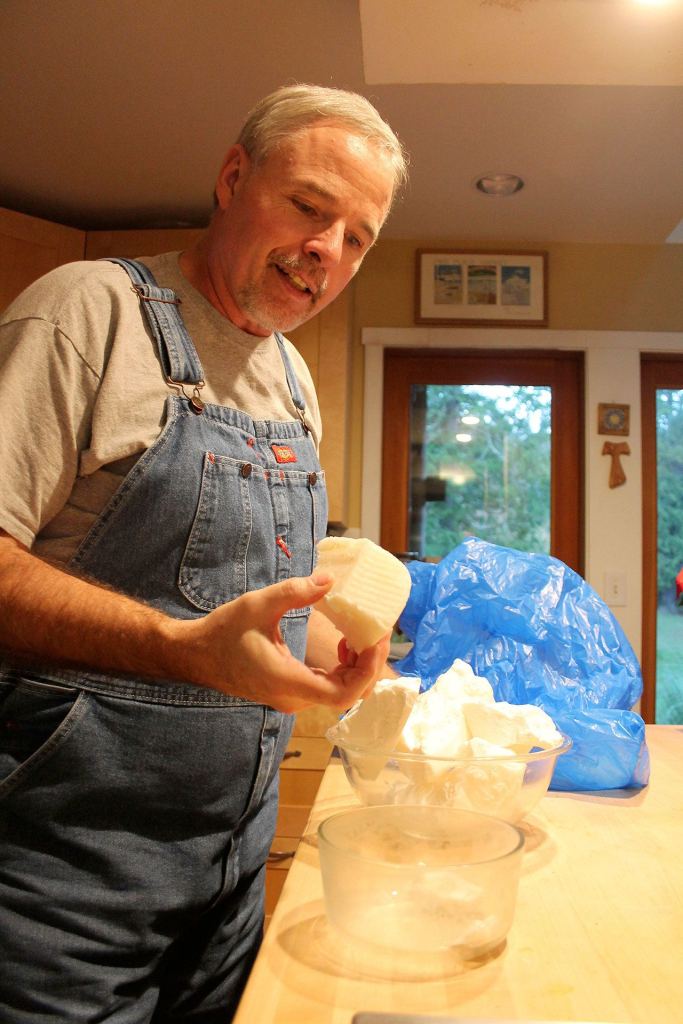 Kyle Jensen / The Record                                Hall holds a chunk of palm oil, one of the base oils used to make soap.