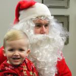 Kyle Jensen / The Record                                1-year-old Isaac Colbet sits on Santa&rsquo;s lap at Maple Ridge Assisted Living in Freeland.