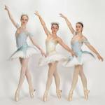 Snowflakes Holley Johnson (left) and Emma Patty-Caldwell (right) danced alongside their Snow Queen Brontë Patty-Caldwell (center) during the Snow Journey.