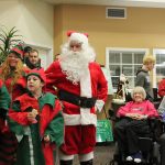 Kyle Jensen / The Record                                Santa and his elves sing Christmas carols in front of the crowd at Maple Ridge Assisted Living in Freeland.