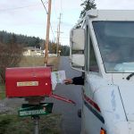 Kyle Jensen / The Record                                Postal carrier Sam Wolfe drops off mail at the South Whidbey Fire/EMS Station 31 in Freeland. South Whidbey has seen a string of attempted mail thefts in the past few weeks.