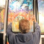 Kyle Jensen / The Record                                Rochon explains how his painting of Seattle and the surrounding sky and water illustrates his life.