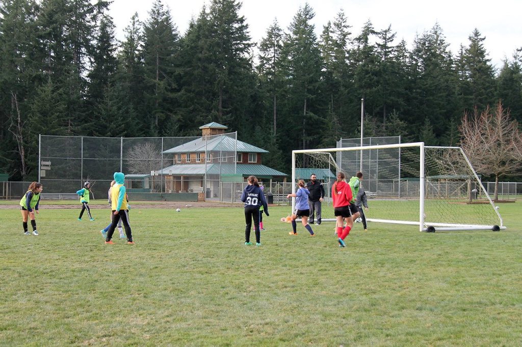Kyle Jensen / The Record                                South Whidbey Reign U-14 girls are practicing on the Community Park baseball fields until the sports complex soccer fields dry out.