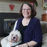 Evan Thompson / The Record                                Peggy Taylor sits with her dog Chico at her home in Langley.