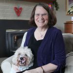 Evan Thompson / The Record                                Peggy Taylor sits with her dog Chico at her home in Langley.