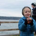 Kyle Jensen / The Record                                Freeland resident Dalan Abernathy, 6, proudly shows off his token from this year&rsquo;s Sea Float Scramble. Abernathy says this is his fourth year.