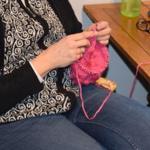 Patricia Guthrie / Whidbey News Group                                Pam Muncey leads a circle of knitters at Langley&rsquo;s Knitty Purls who are making dozens of hats for the Jan. 21 women&rsquo;s marches planned in many cities. In the past month, the store routinely ran short of hot pink yarn and circular knitting needles used to make the simple hat.