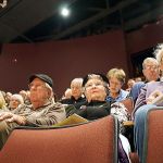 Contributed photo                                Audience members listen to panelists, who discussed how the number of homeless individuals got to where they are today and the steps being taken to lower those numbers.