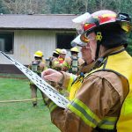 Contributed photo &mdash; Volunteer firefighter and captain Jerry Beck performs his duties as command.
