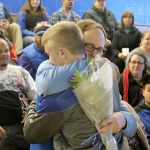 Evan Thompson / The Record &mdash;                                South Whidbey head wrestling coach Jim Thompson hugs senior Hunter Newman prior to the Falcons&rsquo; senior night match against Granite Falls on Jan. 11 at Erickson Gymnasium.