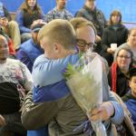 Evan Thompson / The Record &mdash;                                South Whidbey head wrestling coach Jim Thompson hugs senior Hunter Newman prior to the Falcons&rsquo; senior night match against Granite Falls on Jan. 11 at Erickson Gymnasium.