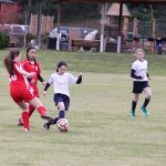 Contributed photo &mdash; Nicole Murnane steps in front of an Issaquah FC player to steal a ball. Elizabeth Haines is behind her in support.
