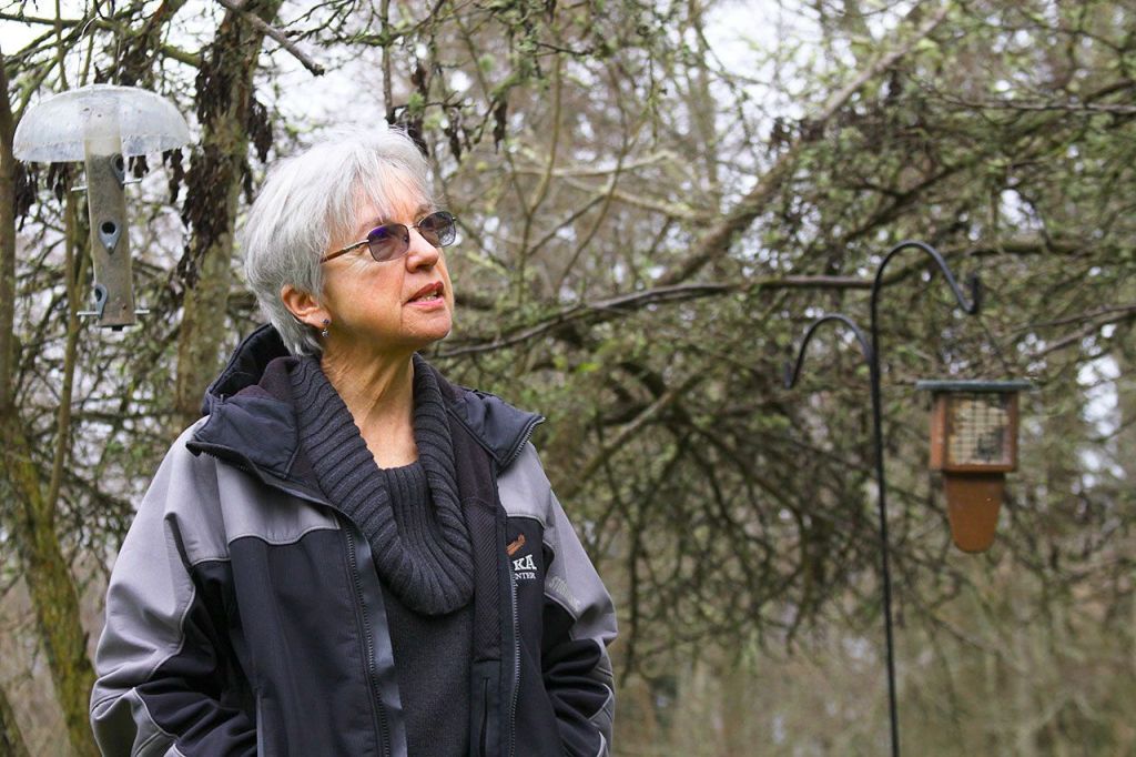 Ron Newberry / Whidbey News Group                                Linda Bainbridge has spotted more than 90 species of birds on her wooded five-acre property in Greenbank. She attracts them by placing feeders in spots that give the birds some cover from predators and not too close to windows to help prevent window strikes.