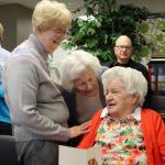Kyle Jensen / The Record &mdash; Alta Brodie (right) is congratulated on her landmark birthday by daughter Marilyn Lueken (left) and friend Audrey Kasperson (center).