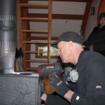 Kyle Jensen / The Record &mdash; All Serv Chimney Services owner Rick Hixon and partner Missy Hixon examine a wood stove at Hedgebrook cabin in Langley.