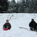 Kids swap books for boards, sleds and skis after Monday snowfall