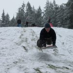 Kids swap books for boards, sleds and skis after Monday snowfall