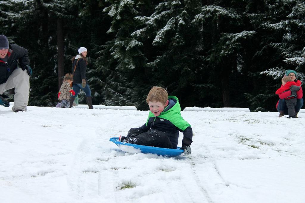 Kids swap books for boards, sleds and skis after Monday snowfall