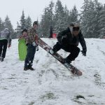 Kids swap books for boards, sleds and skis after Monday snowfall