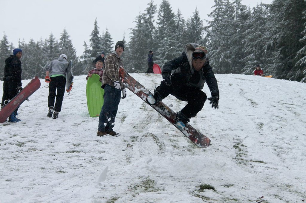 Kids swap books for boards, sleds and skis after Monday snowfall