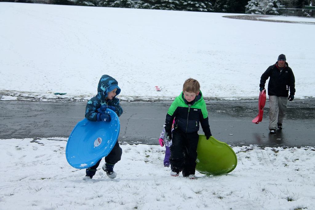 Kids swap books for boards, sleds and skis after Monday snowfall